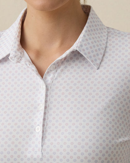 Close-up detail of the Roses Long Sleeve Polo in Cosmic showcasing the white base fabric and pastel rose print