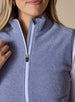 Lucia Vest in Bluestone, close-up front view on model featuring the mock neck collar being pulled open to show the light blue contrast zipper tape and fleece texture detail