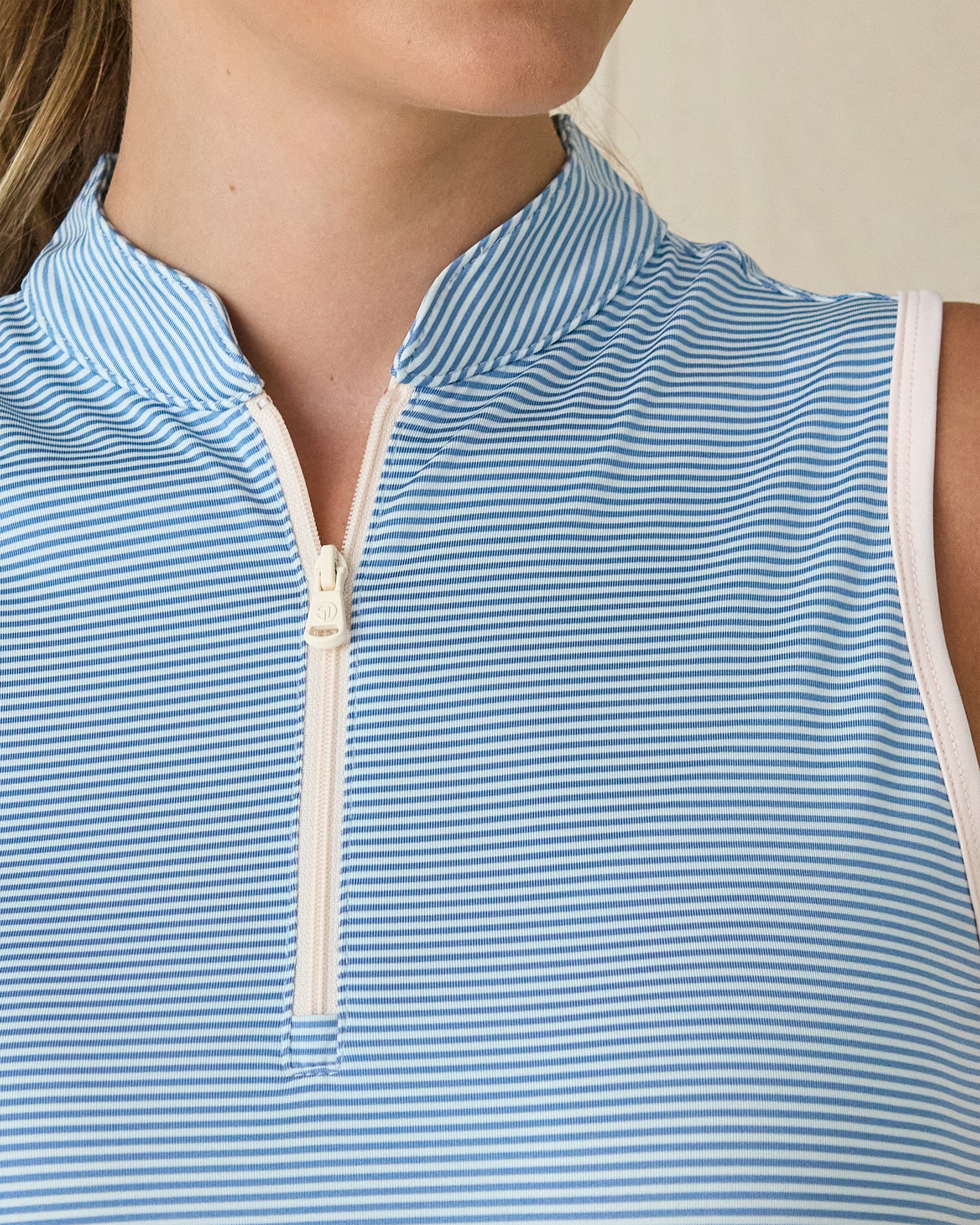 Women's Georgia Stripe Sleeveless Polo in Coastal, collar and zip detail view featuring a light blue and white pinstripe gathered stand collar with white quarter zip hardware and white contrast armhole trim