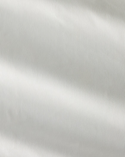 Close-up of the Sindy Polo fabric in Lemongrass, showing its fine vertical ribbed texture.