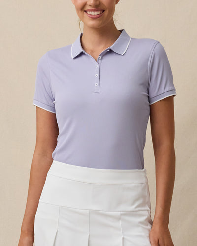 Front model view of the Sindy Rib Knit Polo in Cosmic Purple highlighting the flattering fit, rib knit construction, and contrast-trimmed collar and sleeves