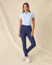 Women's Sindy Rib Knit Polo in Lake, full length front view on model featuring a ribbed knit with white tipped collar, paired with navy pants and white shoes