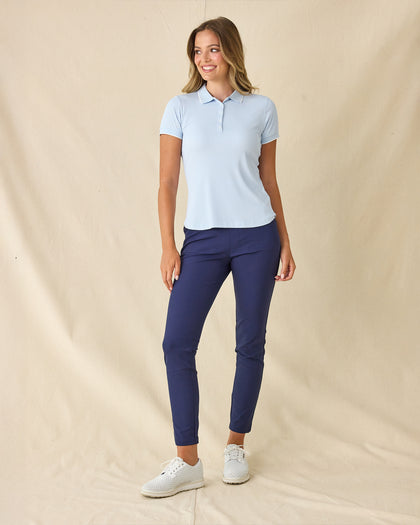 Women's Sindy Rib Knit Polo in Lake, full length front view on model featuring a ribbed knit with white tipped collar and cuffs, paired with navy pants and white shoes