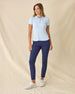 Women's Sindy Rib Knit Polo in Lake, full length front view on model featuring a ribbed knit with white tipped collar and cuffs, paired with navy pants and white shoes
