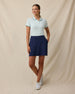 Sindy Rib Knit Polo in Mint Green tucked into navy skort, front model view
