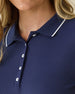 Women's Sindy Rib Knit Polo in New Indigo, close-up front view on model highlighting the white tipped collar and white button placket detail with ribbed knit texture