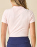 Women's Sindy Rib Knit Polo in Pearl, back model view featuring a light pink short sleeve ribbed knit polo with an embroidered Straight Down logo at the back collar, styled with navy pants