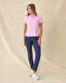 Women's Sindy Rib Knit Polo in Pink Floyd, full length front view on model featuring a ribbed knit with white tipped collar and cuffs, paired with navy pants and white shoes