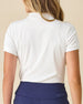 Women's Sindy Rib Knit Polo in White, back view on model featuring a ribbed knit with tonal Straight Down logo embroidered at center back neck, paired with navy pants