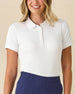 Women's Sindy Rib Knit Polo in White, front view on model featuring a ribbed knit with tonal collar and cuffs and white button placket, paired with navy pants