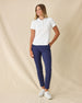 Women's Sindy Rib Knit Polo in White, full length front view on model featuring a ribbed knit with tonal collar and cuffs, paired with navy pants and white shoes