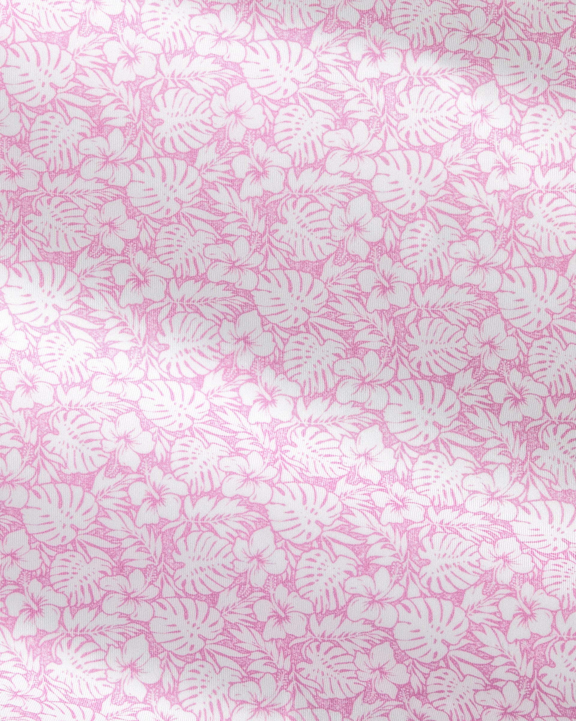 Pink and white tropical floral pattern with monstera leaves and small flowers, shown as a close-up fabric or wallpaper texture.