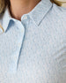 Dog Mom Polo in Coastal, close-up detail view of the collar and upper chest area highlighting the blue line-drawn dog figures on a white background with pearl buttons