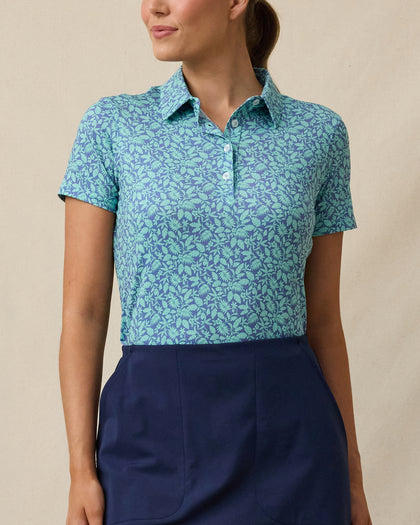 Huli Polo in Tidal Blue with tropical leaf print, front view
