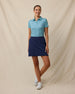 Huli Polo in Tidal Blue with tropical leaf print, tucked outfit view