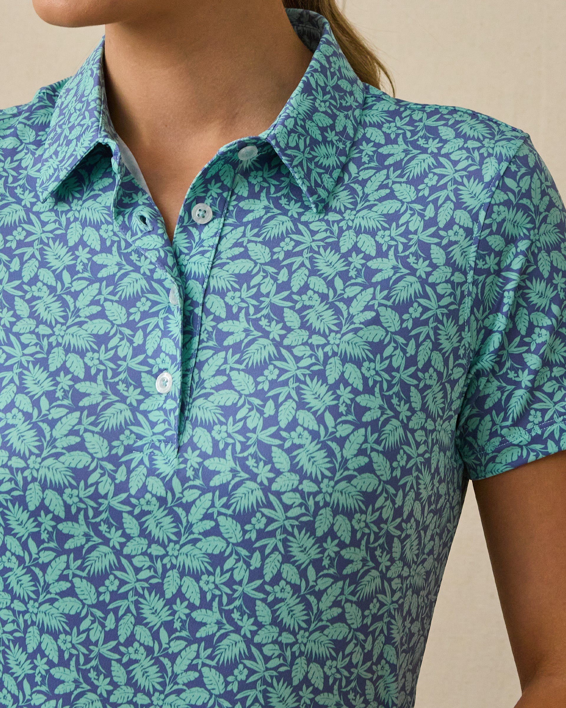 Huli Polo in Tidal Blue with tropical leaf print, detail view