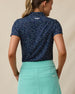 Sprinkles Polo in New Indigo with scattered floral print, back model view
