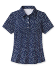 Sprinkles Polo in New Indigo with scattered floral print, front view