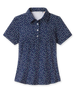 Sprinkles Polo in New Indigo with scattered floral print, front view