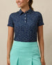 Sprinkles Polo in New Indigo with scattered floral print, front model view