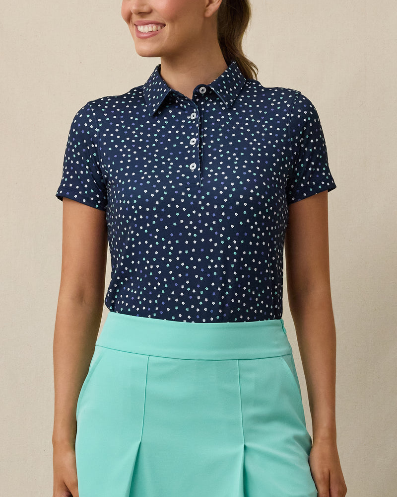 Sprinkles Polo in New Indigo with scattered floral print, front model view