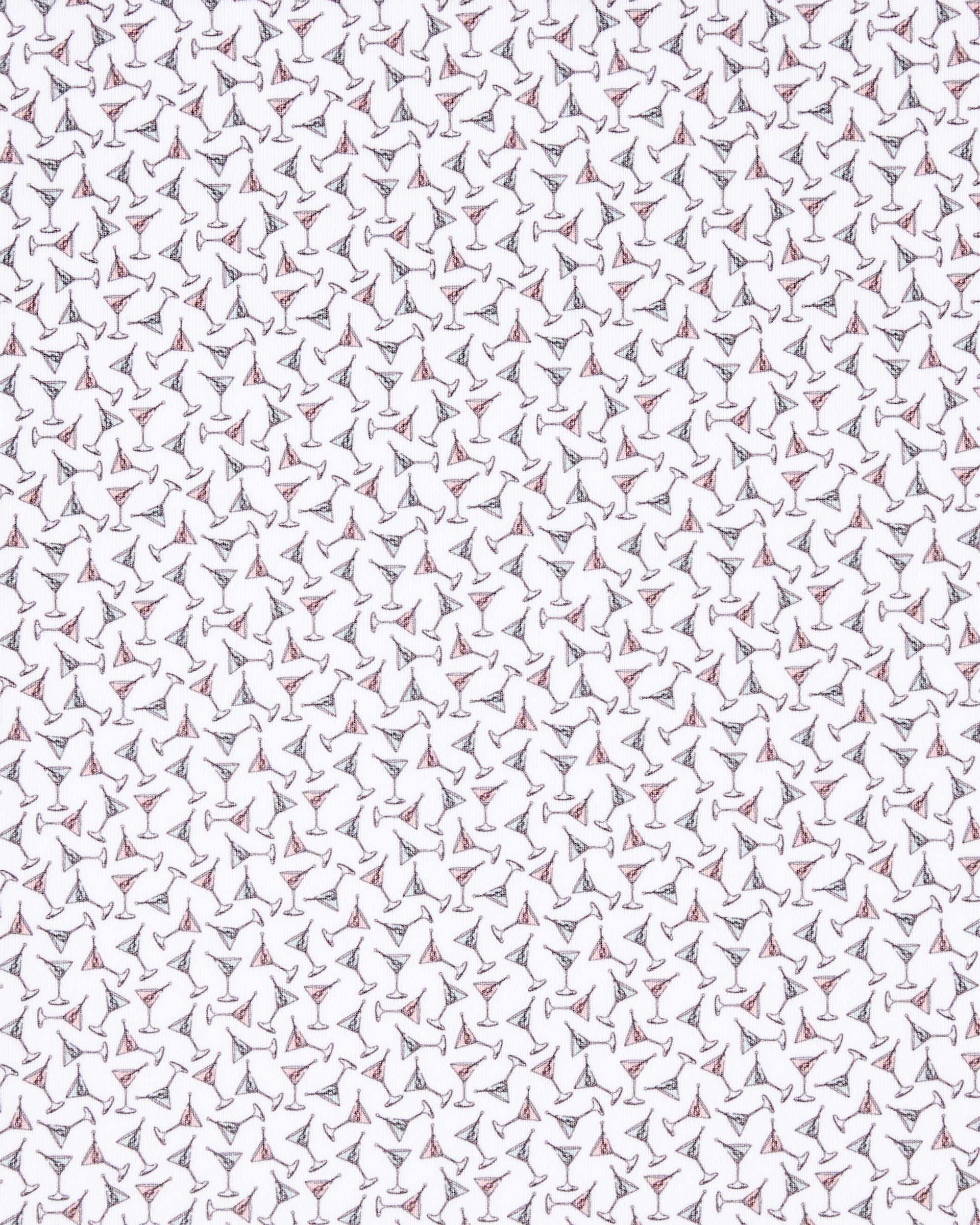 Close-up of the Martini Girl Polo in Lemongrass fabric featuring an allover pattern of miniature martini glasses with subtle pink and dark accents.