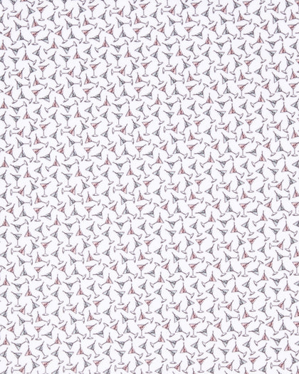 Close-up of the Martini Girl Polo in Lemongrass fabric featuring an allover pattern of miniature martini glasses with subtle pink and dark accents.
