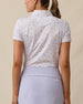 Back view of the Wonderland Polo in White showcasing the allover floral print