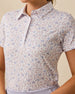 Close-up detail of the Wonderland Polo in White featuring an allover floral and botanical print