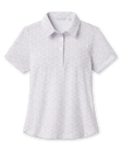 Front product view of the Palm Island Polo in Lemongrass, featuring an allover pastel tropical print, short sleeves, pointed collar, and button placket.