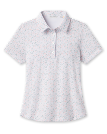 Front product view of the Palm Island Polo in Lemongrass, featuring an allover pastel tropical print, short sleeves, pointed collar, and button placket.