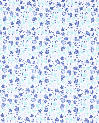 Close-up of the Palm Island Polo in Tidal fabric featuring a pastel print of palm leaves, flowers, tropical foliage, and cocktail motifs.