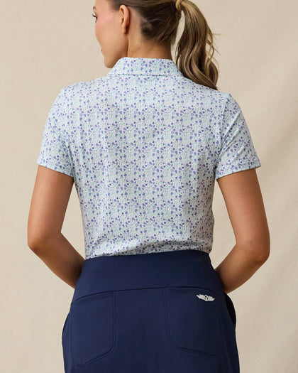 Palm Island Polo in Tidal blue with tropical floral print, back model view