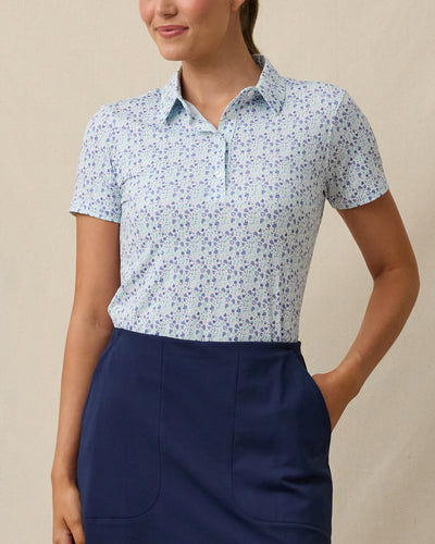 Palm Island Polo in Tidal blue with tropical floral print, front model view