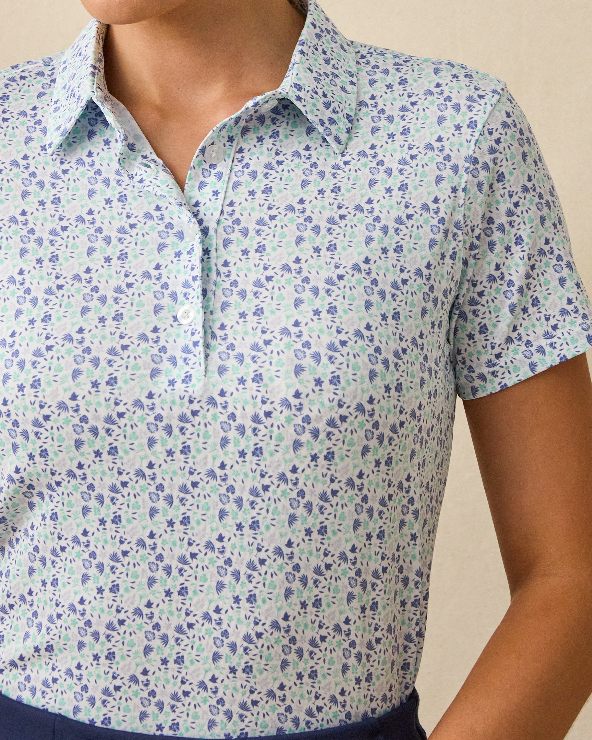 Palm Island Polo in Tidal blue with tropical floral print, print detail view