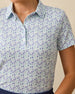 Palm Island Polo in Tidal blue with tropical floral print, print detail view