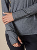 Straight Down Women's Claire Quarter Zip in Black, close up detail view highlighting the contrast black seam detailing and thumb hole cuffs