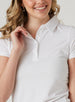 Women's Abbot Polo in White, detail close-up view featuring the spread collar and short sleeve construction