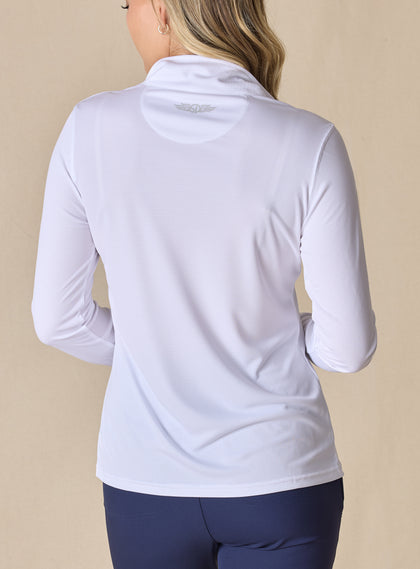 Women's Aero Quarter Zip in White, back view on model featuring a clean white performance fabric with a subtle logo at the upper back and long sleeves, paired with navy pants