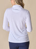 Women's Aero Quarter Zip in White, back view on model featuring a clean white performance fabric with a subtle logo at the upper back and long sleeves, paired with navy pants