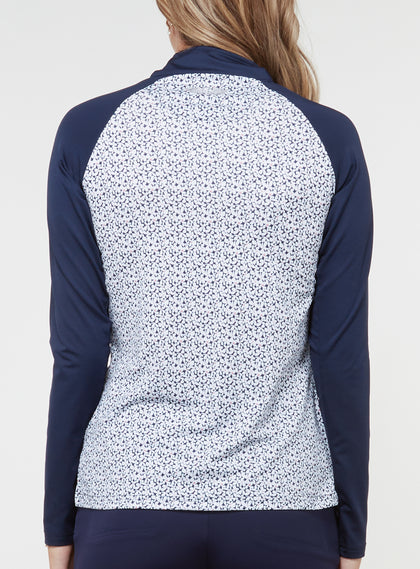 Straight Down Women's Daizee Quarter Zip in New Indigo, on model back view showing white floral print body with solid navy raglan sleeves