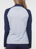 Straight Down Women's Daizee Quarter Zip in New Indigo, on model back view showing white floral print body with solid navy raglan sleeves