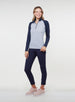 Straight Down Women's Daizee Quarter Zip in New Indigo, on model full length view showing white floral print body with navy raglan sleeves paired with navy pants and pink golf shoes