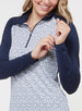 Straight Down Women's Daizee Quarter Zip in New Indigo, on model close-up view showing white floral print body detail with solid navy raglan sleeves and quarter zip closure