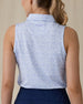 Women's Hydra Sleeveless Polo in Lavender, back on-model view featuring a white sleeveless polo with an allover small floral print in light blue tones, spread collar, and Straight Down logo embroidered at the upper back, paired with navy pants