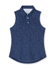 Cherry Bloom Sleeveless Polo in New Indigo, flat lay front view featuring a navy base with a scattered white and pink floral print