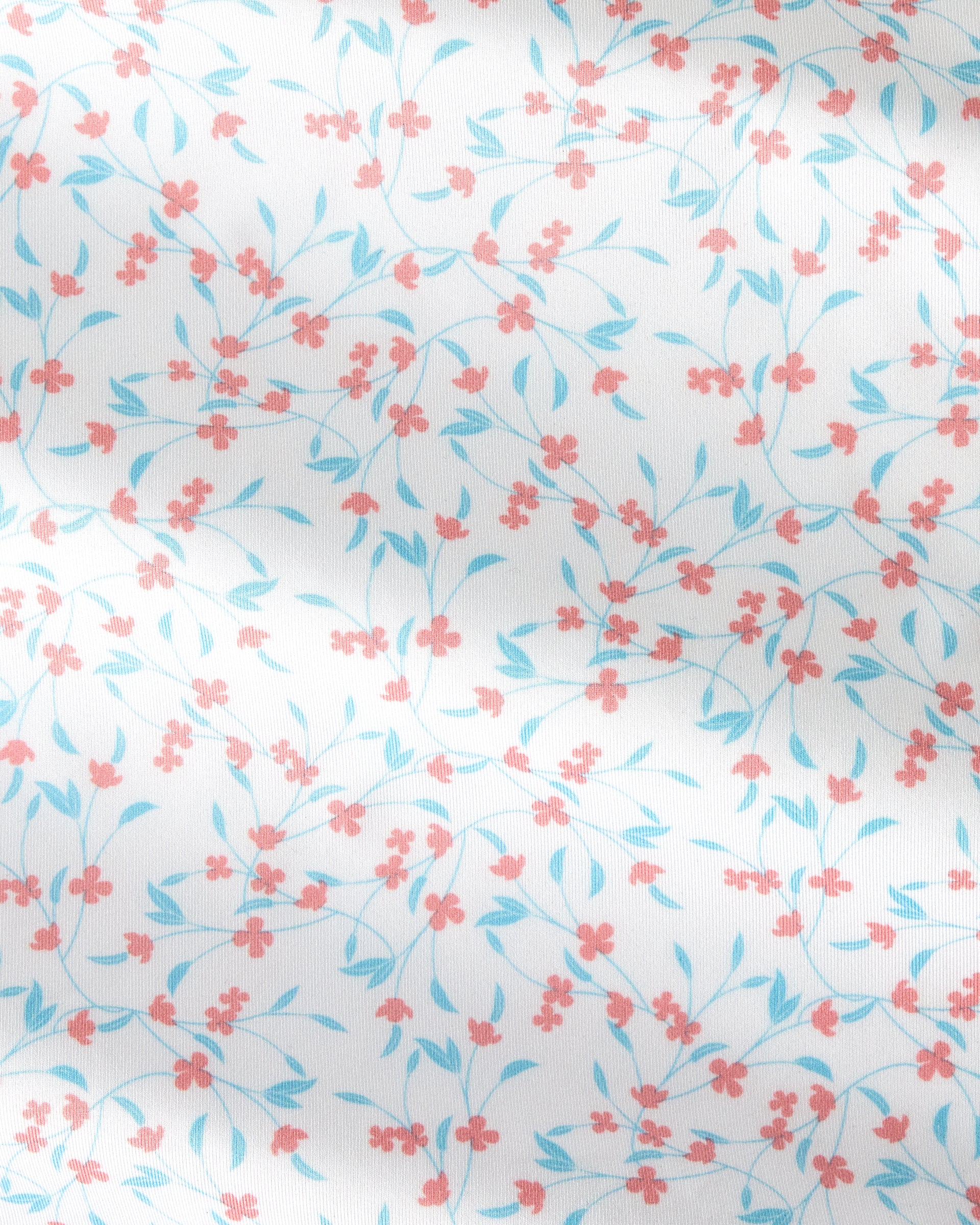 White fabric with a delicate repeating floral pattern of small coral-pink blossoms and light blue leaves on thin stems.