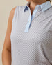 Close-up of the Milano Sleeveless Polo in Lake showing the geometric print, light blue contrast collar, button placket, and sleeveless design.