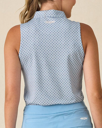 Milano Sleeveless Polo in Gemstone, back view featuring a white base with navy geometric medallion allover print pattern with Straight Down embroidered logo at the back collar, paired with a light blue skort