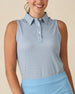Milano Sleeveless Polo in Gemstone, front view featuring a white base with navy geometric medallion allover print pattern, paired with a light blue skort